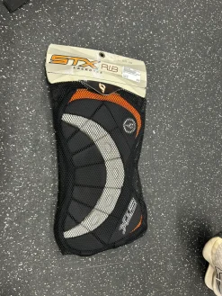 Used STX Lacrosse Rib Pads Black LG